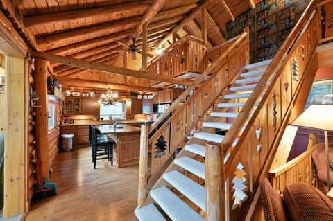 When you come out of the sitting room you will go past the stairs into the kitchen.