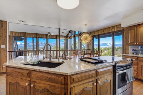 Kitchen island with views of Pike's Peak and Air Force Academy.