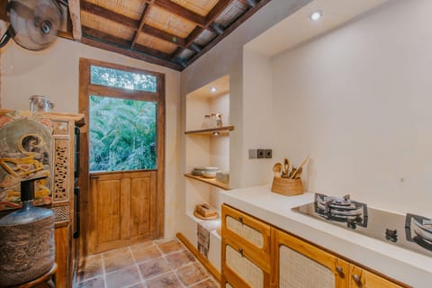 Deluxe Villa | Private kitchen | Stovetop, electric kettle, toaster, rice cooker