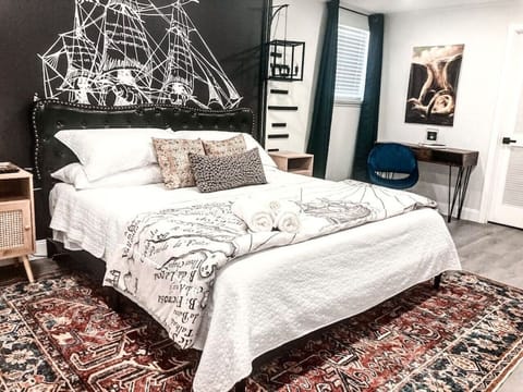 The master bedroom is separate from the rest of the home, it comes with a king size bed, 40` smart tv, a private closet and semi private bathroom ensuite. The master also comes with a private office space.
