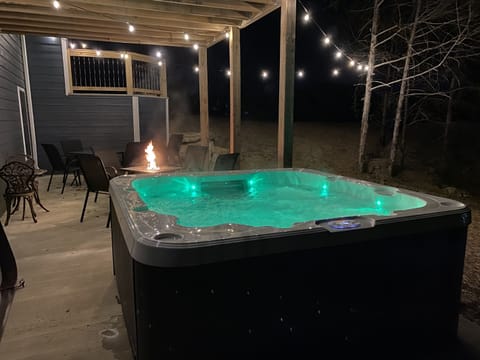 Enjoy your private 7 person hot tub near the propane fire pit & outdoor seating!