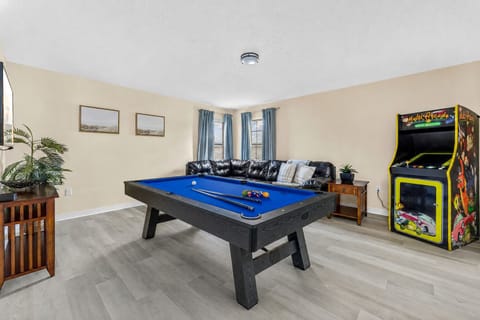 Upstairs:   Family room with Tv and arcade game
