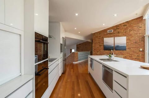 Fully equipped kitchen featuring 2 stoves and two dishwashers