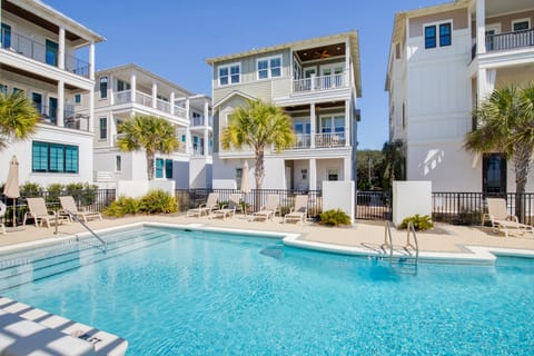 The community pool is only steps away, making it perfect for a quick swim or a day of lounging.