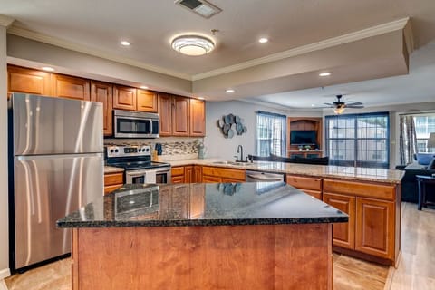Large fully stocked kitchen with pots, pans, crock pot, coffee pot, and keurig.