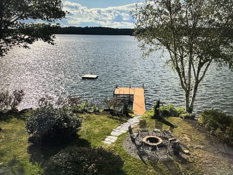View of lake and fire pit from house