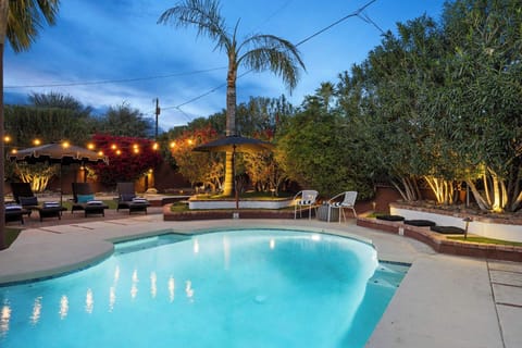 Your private backyard oasis, sparkling pool, lush landscaping, and plenty of space to unwind.