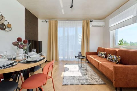 Living room with a comfortable sofa and TV. 
