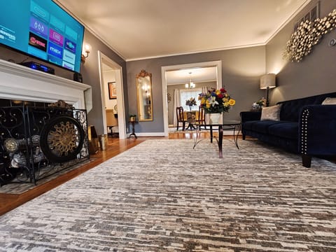 Harwood floors and faux fireplace embellish this elegant space. 