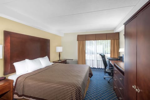 Desk, laptop workspace, blackout drapes, iron/ironing board