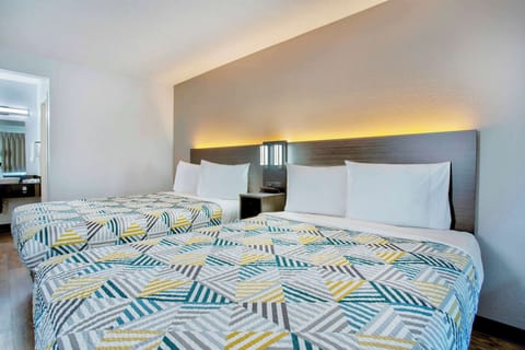 Desk, laptop workspace, blackout drapes, iron/ironing board