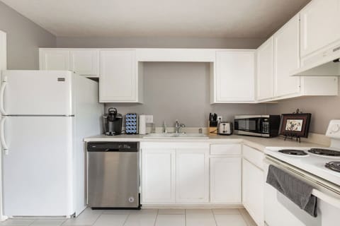 Fully stocked kitchen with basic cleaning and cooking supplies. Keurig coffee maker and coffee provided.