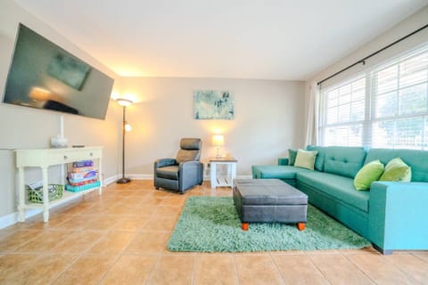 Living room with full size pull out couch (firm). 58” TV. No streaming/cable/satellite provided. Must use your own accounts to watch TV.