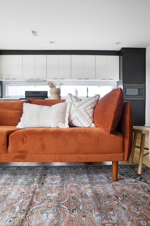 A pop of color with high-end fabric and layered pillows.