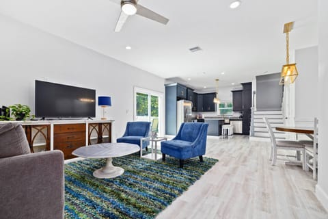 Spacious Living Room and Kitchen with Natural Light.