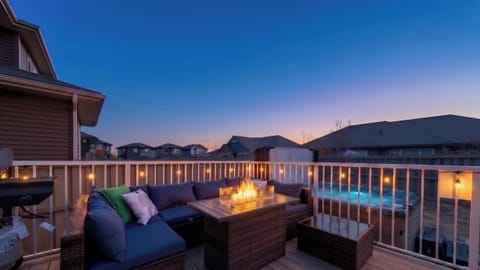 Architectural twilight views of the private deck, fire pit, and hot tub