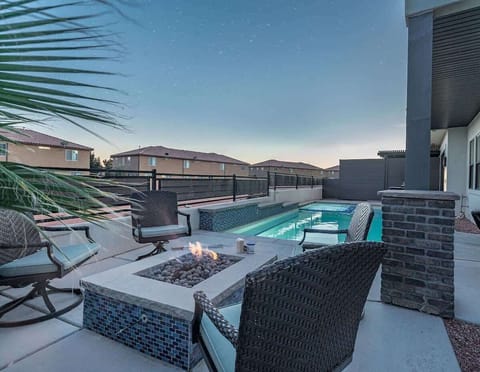 Pool area with comfortable seating, firepit and lounging area