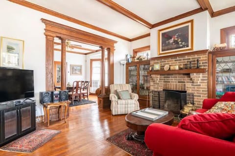 Living Room: Elegant woodwork meets inviting seating—perfect for relaxation and gatherings!