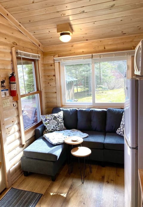 "Tiny House" cottage with seating for three.