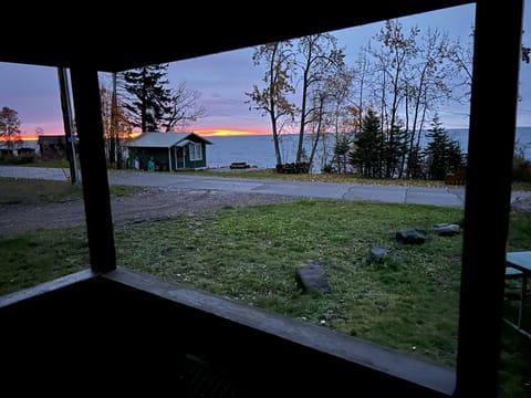 Early morning fall sunrise from the dining table on the front porch.