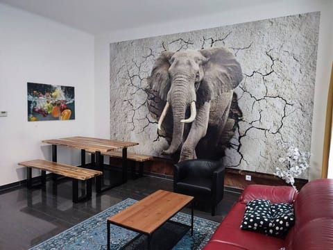 Step into the living room, where Arbio Designers` expertise shines through, creating a warm and inviting atmosphere, perfect for socializing or watching TV