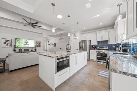 A kitchen island with a view! This stunning kitchen island features a built-in aquarium, making it the perfect place to prepare meals and entertain guests.