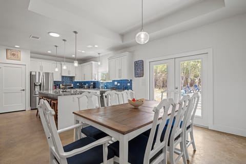 Dining Room: Gather around the charming farmhouse table with nature views and modern flair!