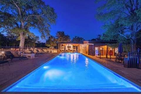 Poolside Paradise: Dive into gleaming waters under a starry sky—your perfect evening awaits!