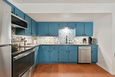 A full kitchen with stainless steel appliances