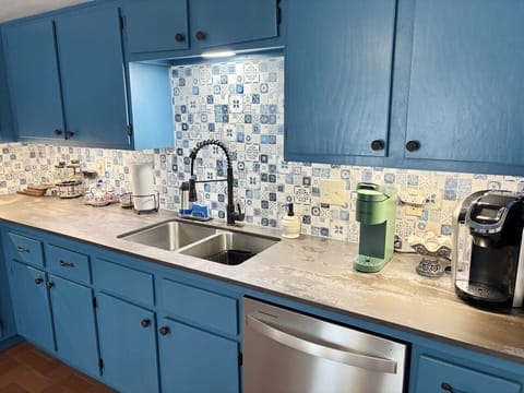 A full kitchen with stainless steel appliances