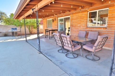 Covered patio with table and chairs