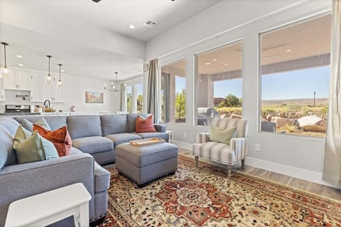 This inviting living room boasts vibrant hues reflecting the beauty of the surrounding desert landscape.