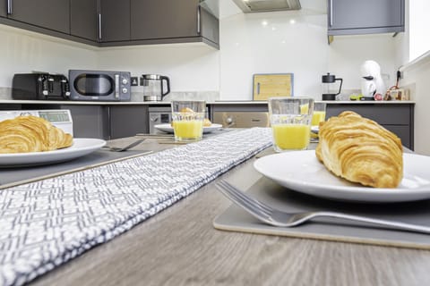 Stylish dining table, perfect for enjoying meals or gathering with friends and family in a warm, inviting space.