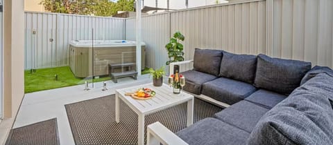 Alfresco dining area and a modern outdoor spa.