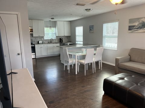 Top floor full kitchen and dining, table for 4 and 2 bar stools at counter