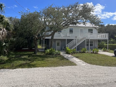 Home with 2 parking spaces on gravel and 2 spaces in driveway.