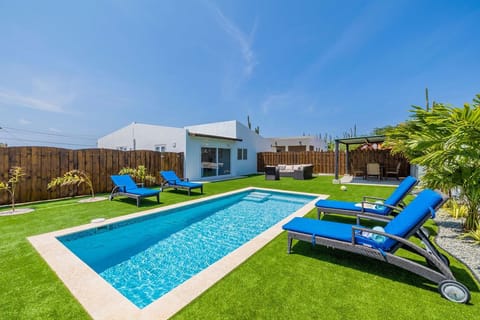 Enjoy your day with this crystal blue outdoor swimming pool or just relax in the sun in one of the loungers around the pool.