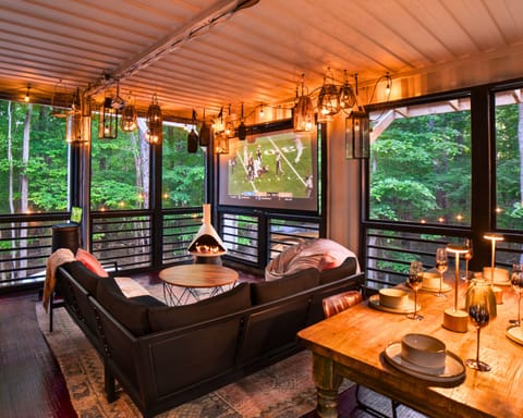 20 x 20 Screened in Porch! *NOTE* Projector needs phone or laptop. Provided: HDMI, lightning & USBC adaptors! This is a screened in porch, and will be the temperature of the outdoors. We provide 2 gas restaurant style heaters.  