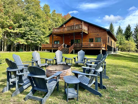 Fire ring with outside seating, backyard, back of house.