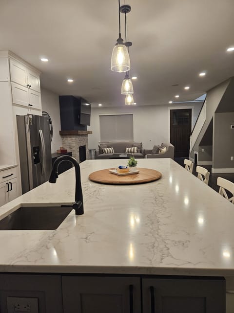 A view from the kitchen sink, highlighting the large island and the prep sink.