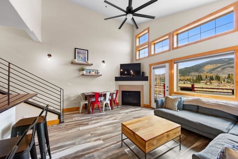 Relax in your bright, modern living space with stunning mountain views, cozy fireplace, and open design perfect for unwinding after adventure.