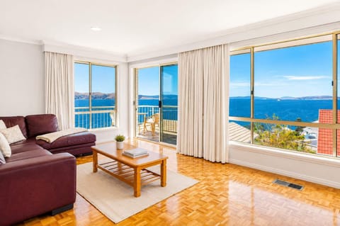 Wake up to breathtaking panoramic views across the River Derwent. Relax in the light-filled living area with direct balcony access and stunning water views.