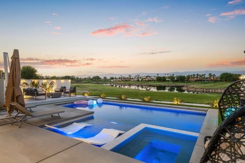 Unwind in the glowing spa at sunset w/ panoramic views & twinkling lights.