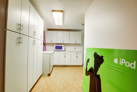 Lower-Level Utility Room with Pantry Cabinets and Additional Storage