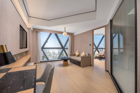 Deluxe Suite, 1 King Bed | Premium bedding, down comforters, minibar (free items), in-room safe