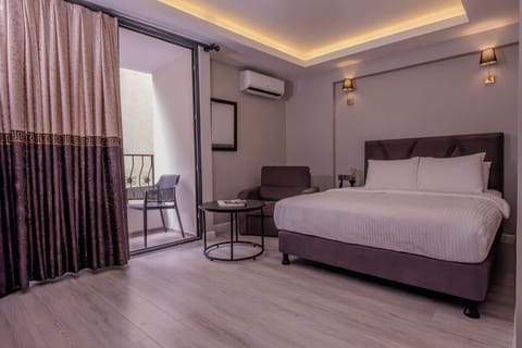 Superior Room with Balcony | In-room safe, laptop workspace, blackout drapes, soundproofing