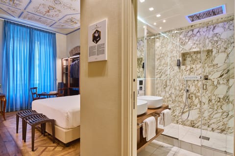 King Room | Bathroom | Designer toiletries, hair dryer, bathrobes, slippers