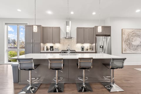 Full kitchen with large island & additional seating.