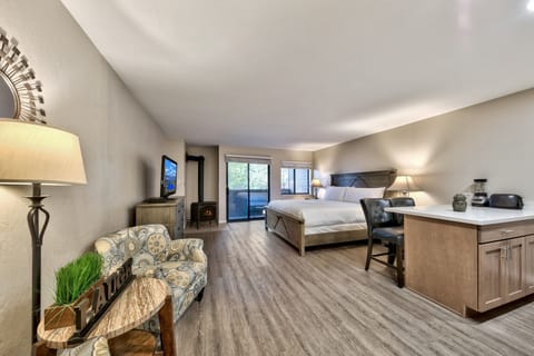 Unwind in your spacious suite with cozy fireplace, comfortable seating, and thoughtful amenities creating the perfect mountain retreat atmosphere.