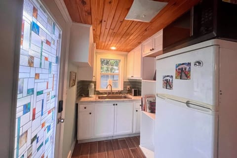 Small kitchen with refrigerator and microwave
